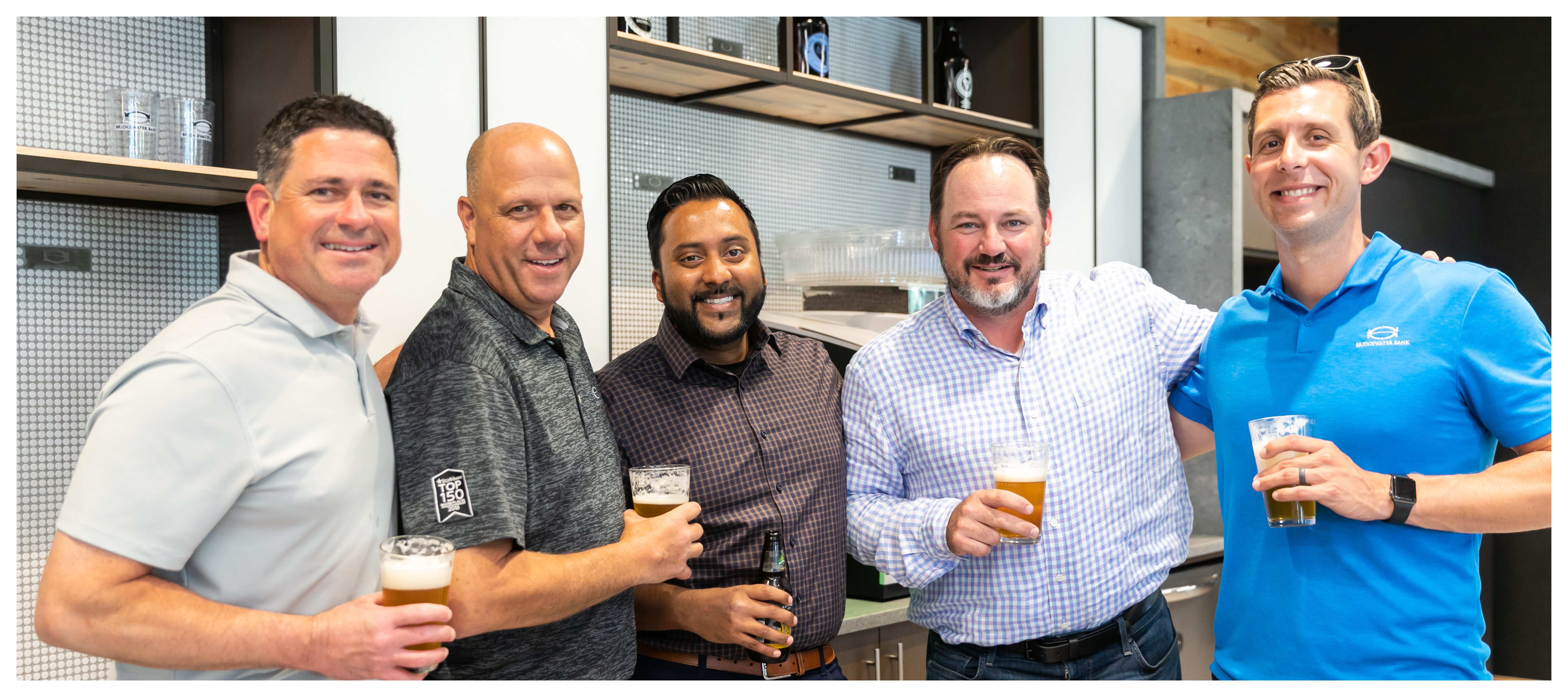 Group photo of Bridgewater team members at an internal happy hour.